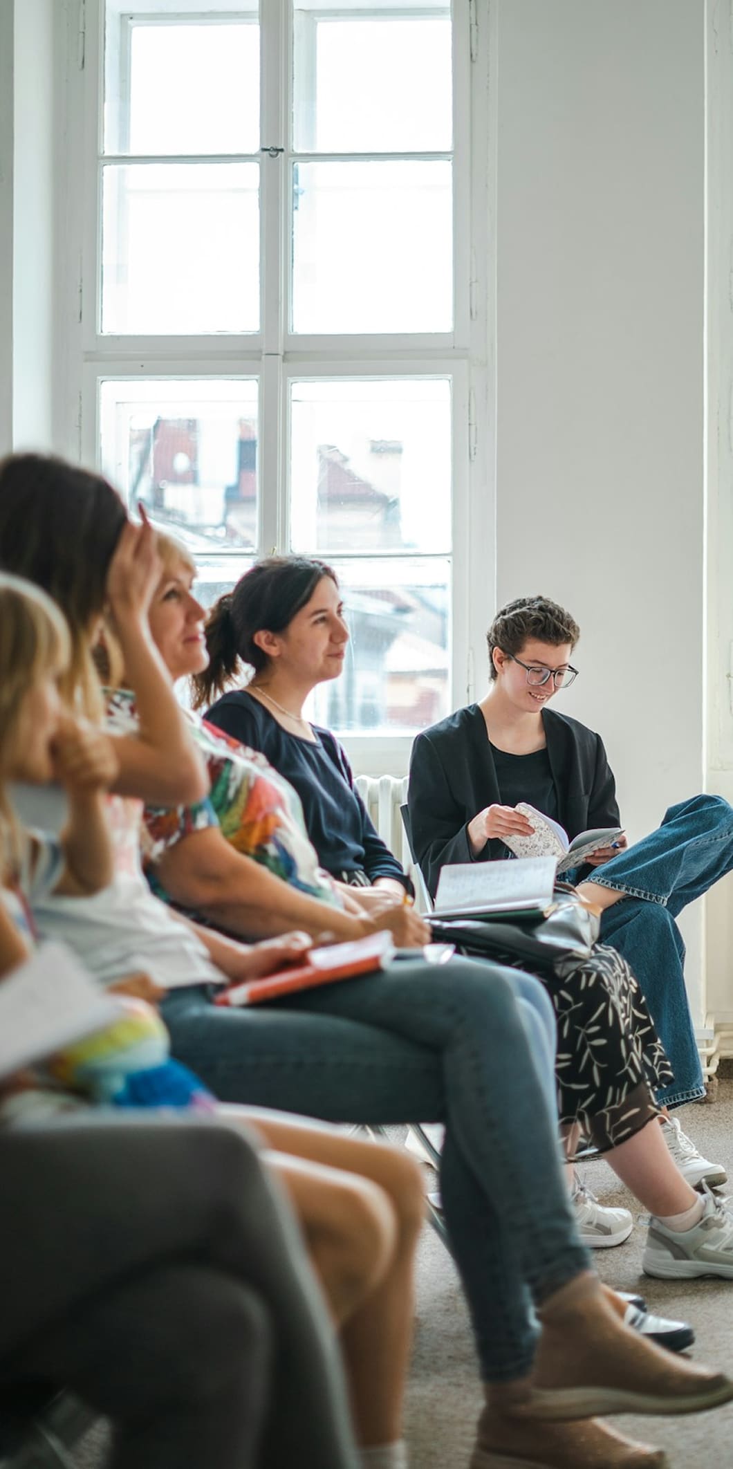 A group of people sitting in a room